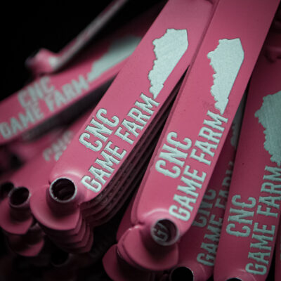 Pink custom engraved leg bands for CNC Gamefarm