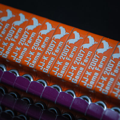 Orange custom engraved ZIP wing bands for JJ-K 2007 Game Farm