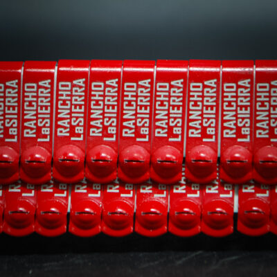 Red custom engraved JIFFY wing bands for Rancho Lasierra